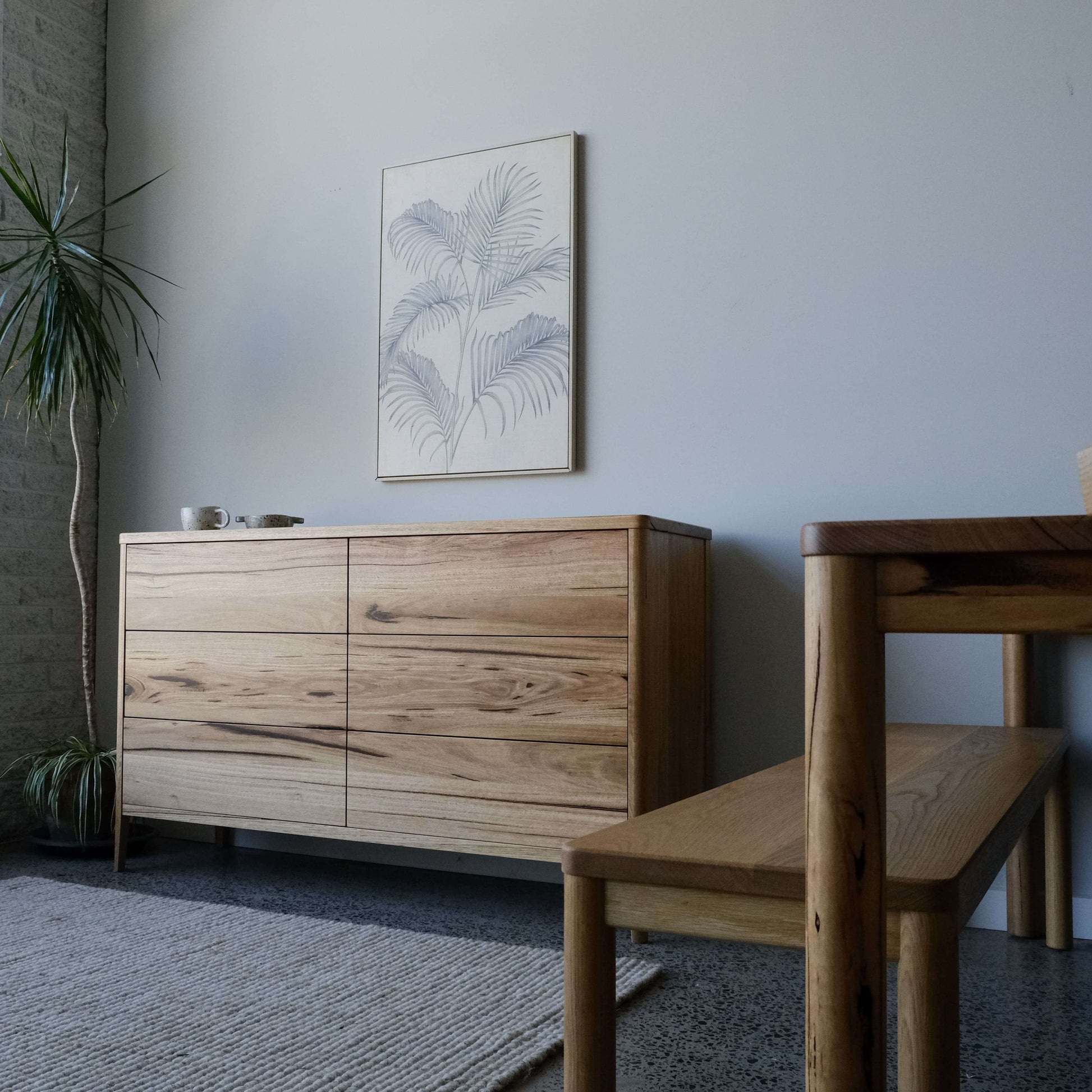 Mayfield sideboard in Wormy Chestnut, modern Scandinavian design with tapered legs and 6 drawers.