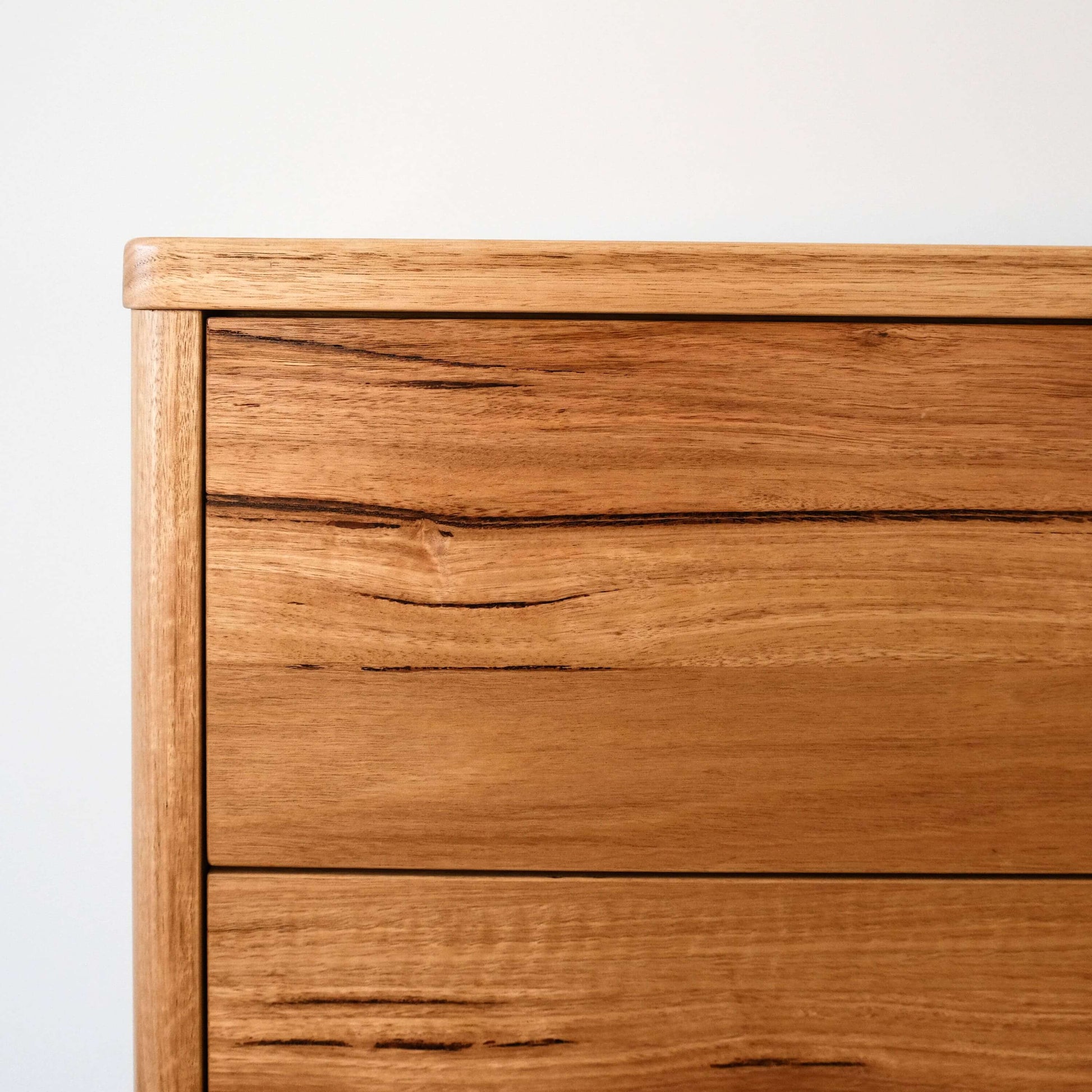 Close-up of Wormy Chestnut surface showcasing unique grain patterns of the Mayfield sideboard dresser.