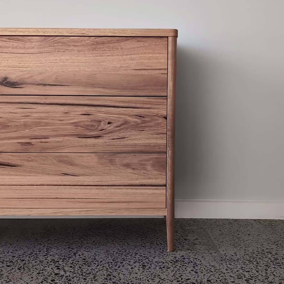 Mayfield Sideboard in Wormy Chestnut with tapered legs, featuring 6 drawers and modern Scandinavian design.