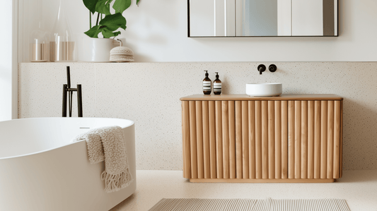 Modern bathroom with a custom bathroom vanity, white bathtub, and decorative items.